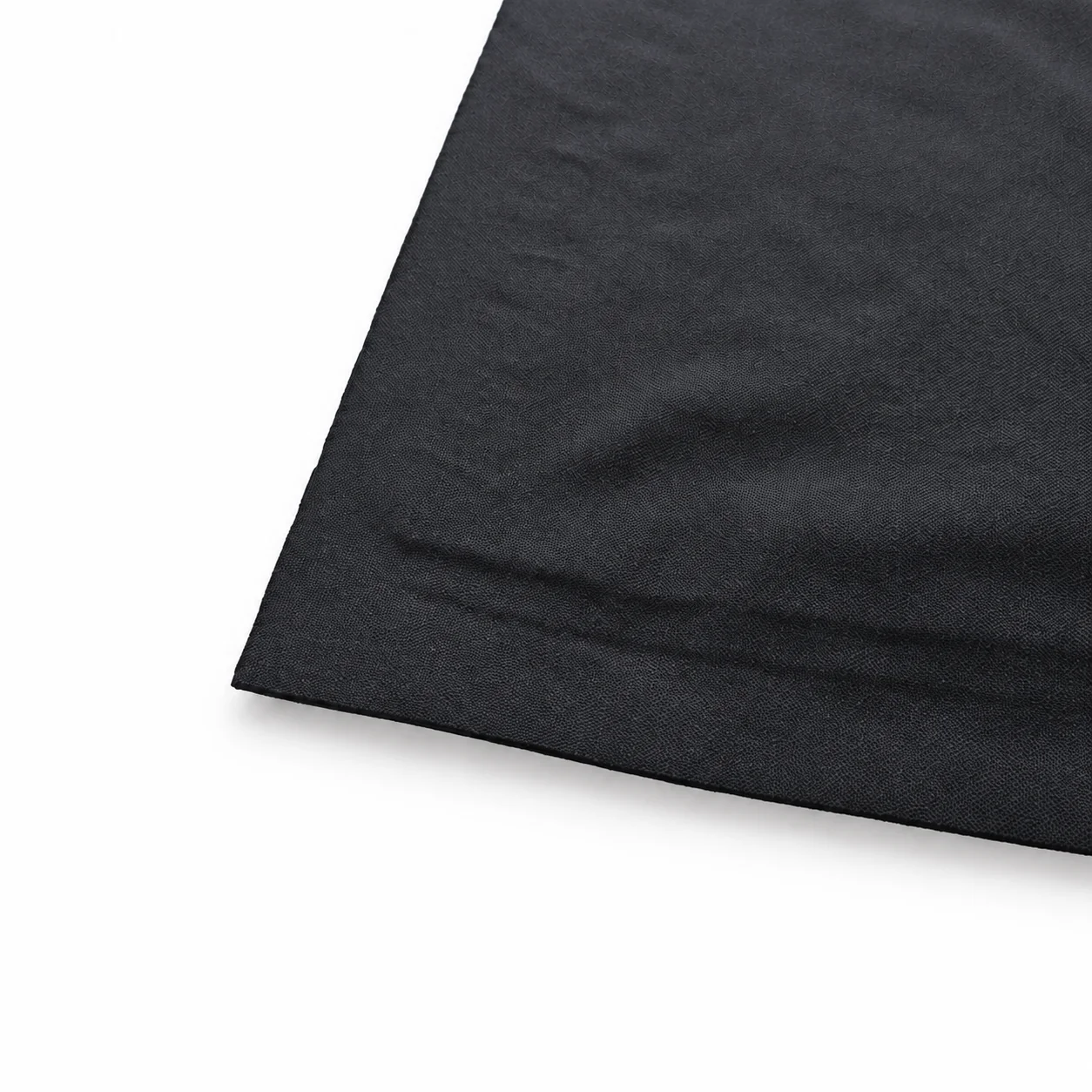 Macro close-up of the Tactilus pressure mapping mat's corner, showing the fabric weave
