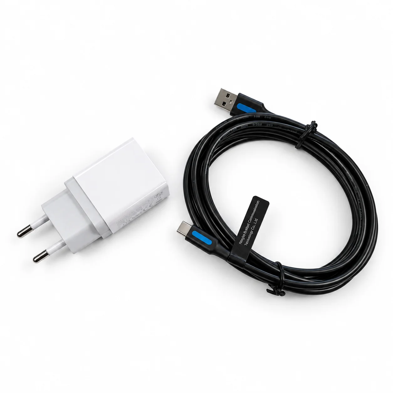 White European power adapter and coiled USB-A to USB-C cable for the Tactilus system
