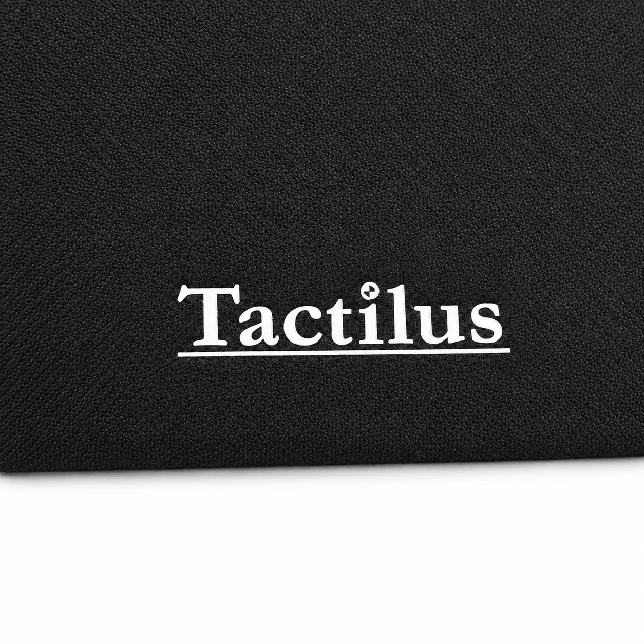 Close-up of the white Tactilus logo embossed on the charcoal fabric sensor mat